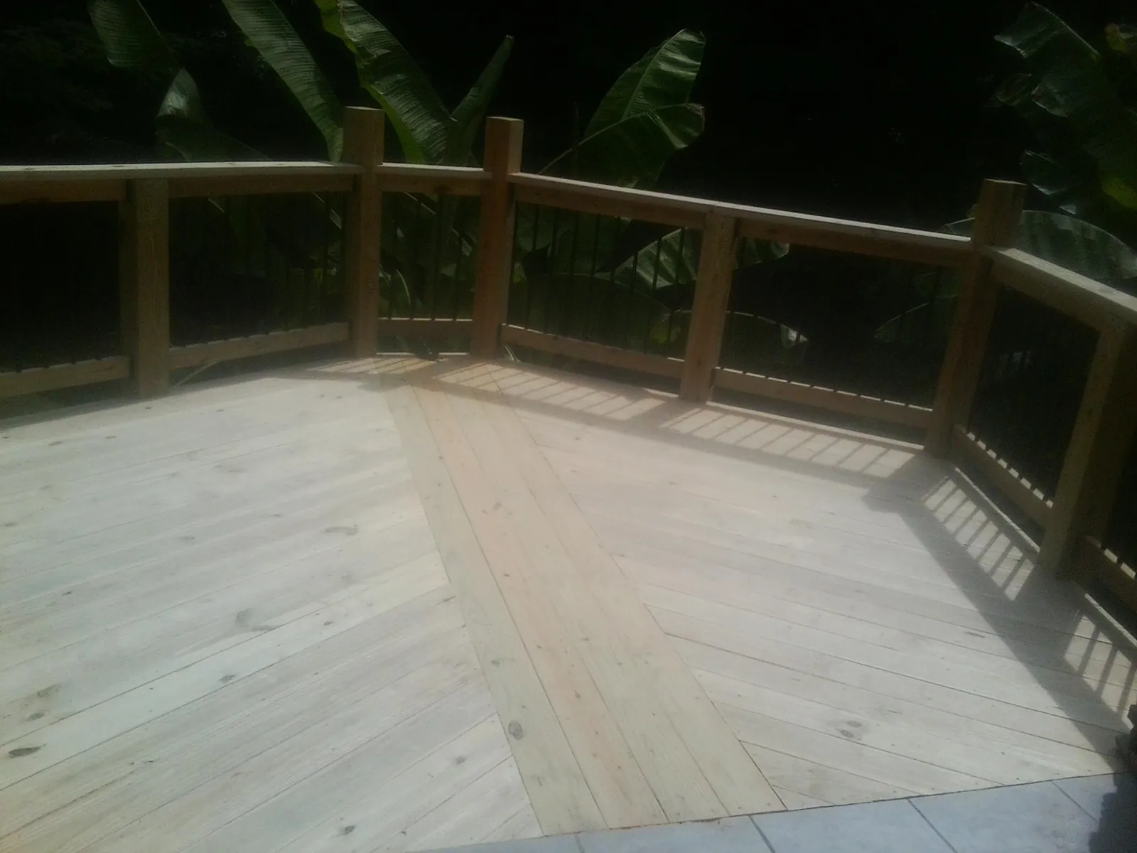 New wood deck and railing built off the back of a home in Garrett